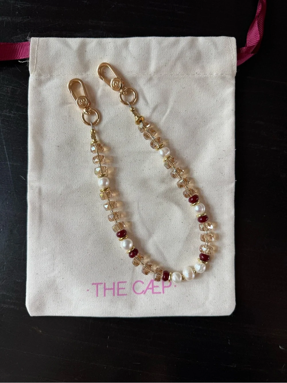 The Cæp Gold, Pearl & Ruby Beaded wristlet